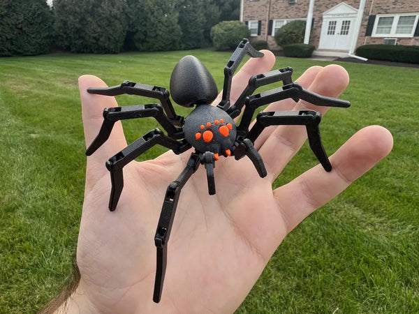 A fully articulated print-in-place 3D printed spider with jointed legs, made as a Halloween decoration