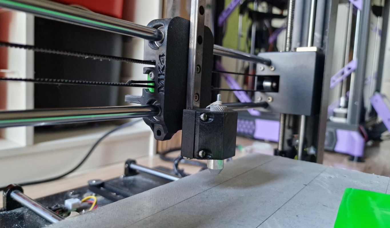 Old 3D printer converted into a vinyl cutter with a drag knife in place of the extruder