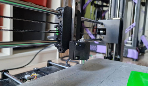 Old 3D printer converted into a vinyl cutter with a drag knife in place of the extruder