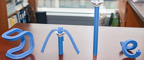 Close-up of a 3D-printed three-sided Y-zipper fastener that toggles an object between soft and rigid states