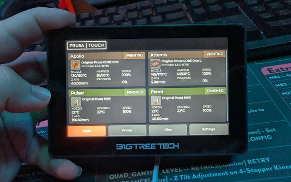 A BigTreeTech touchscreen running custom firmware that displays live status for a fleet of Prusa 3D printers